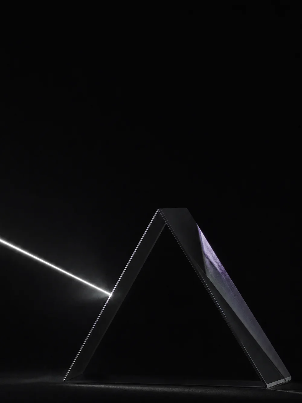 A beam of light travelling toward a glass prism